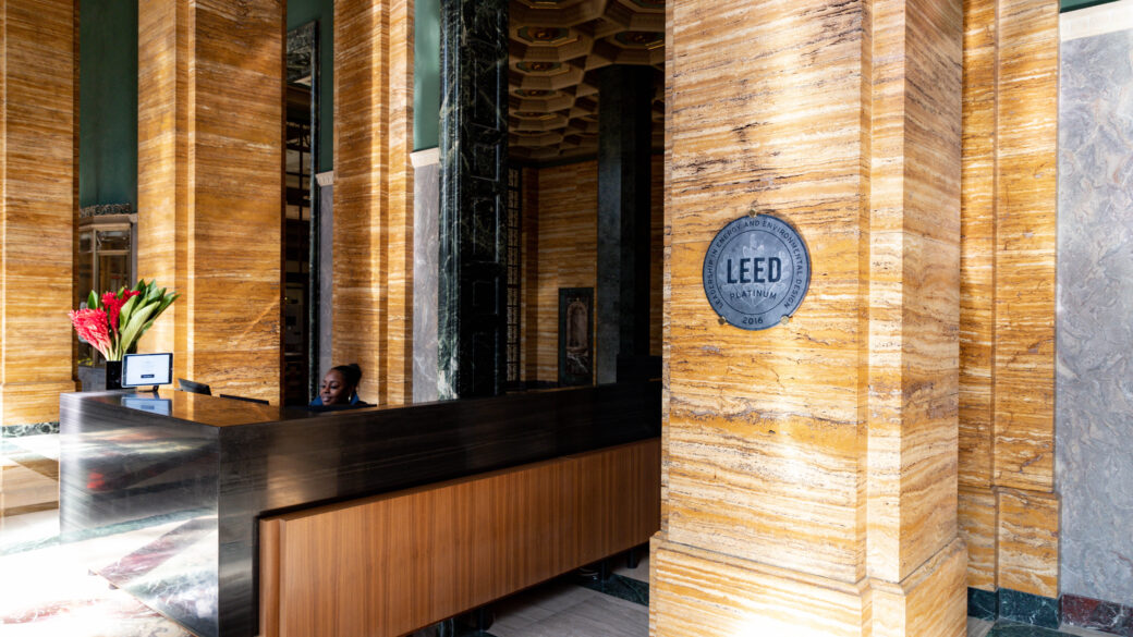 Interior photo of The CalEdison DTLA lobby with the LEED Platinum plaque prominently hanging on the wall.