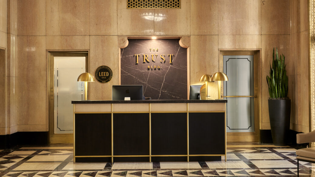 Photo of the reception desk in The Trust Building lobby.
