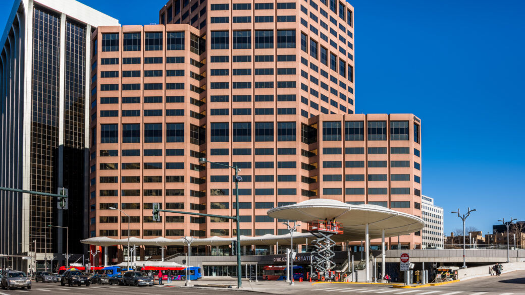 A panoramic view of Denver's Civic Center Plaza at midday.