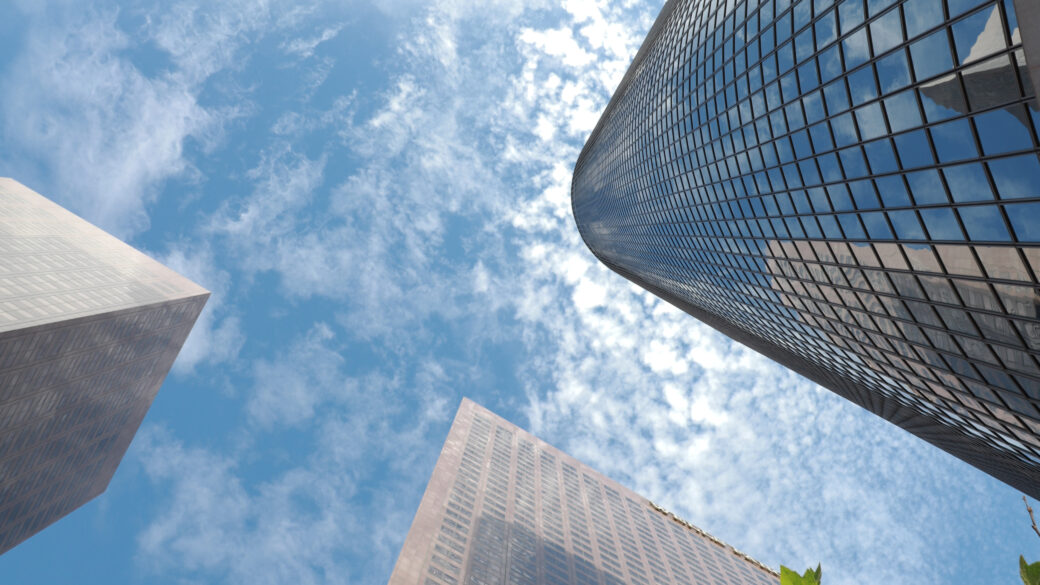 A stunning skyward view of 1 Cal Plaza , its glass and steel architecture gleaming in the daylight.
