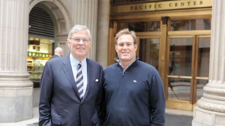 A photo of Nelson Rising and Chris Rising in front of The Trust Building in DTLA