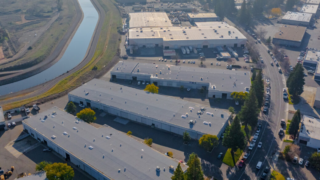 Aerial view of Sacramento Industrial Park with the cityscape in the background.