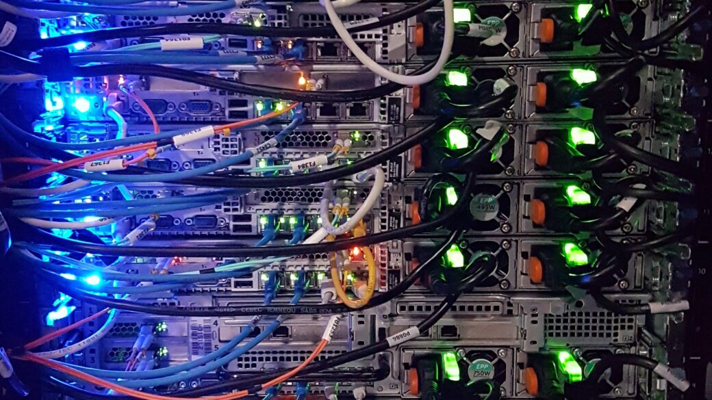 Close-up photo of the rear of a server stack inside a data center.